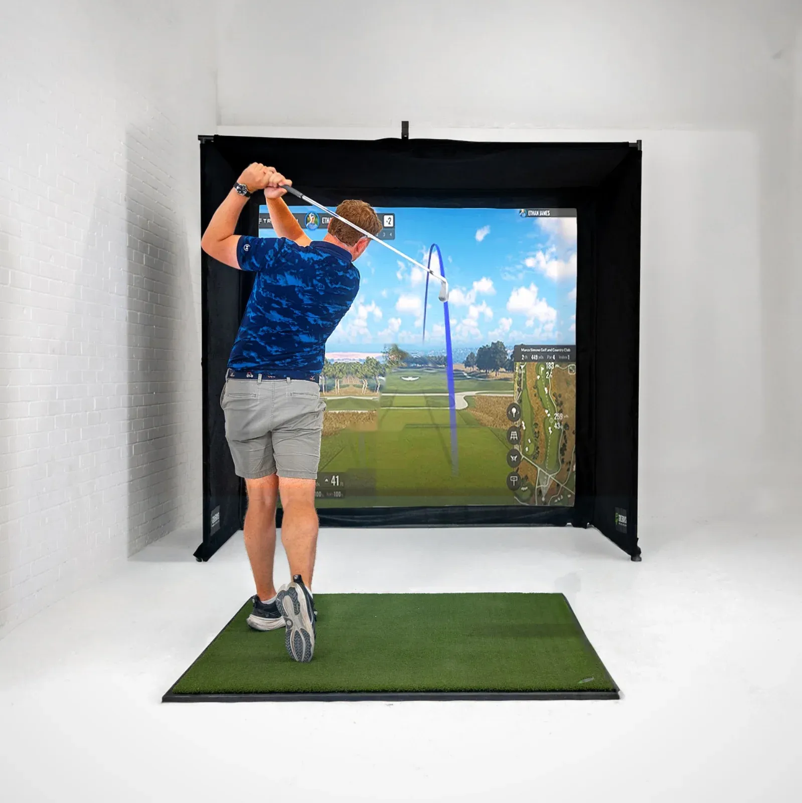GolfBays SimBox golf simulator enclosure with impact screen