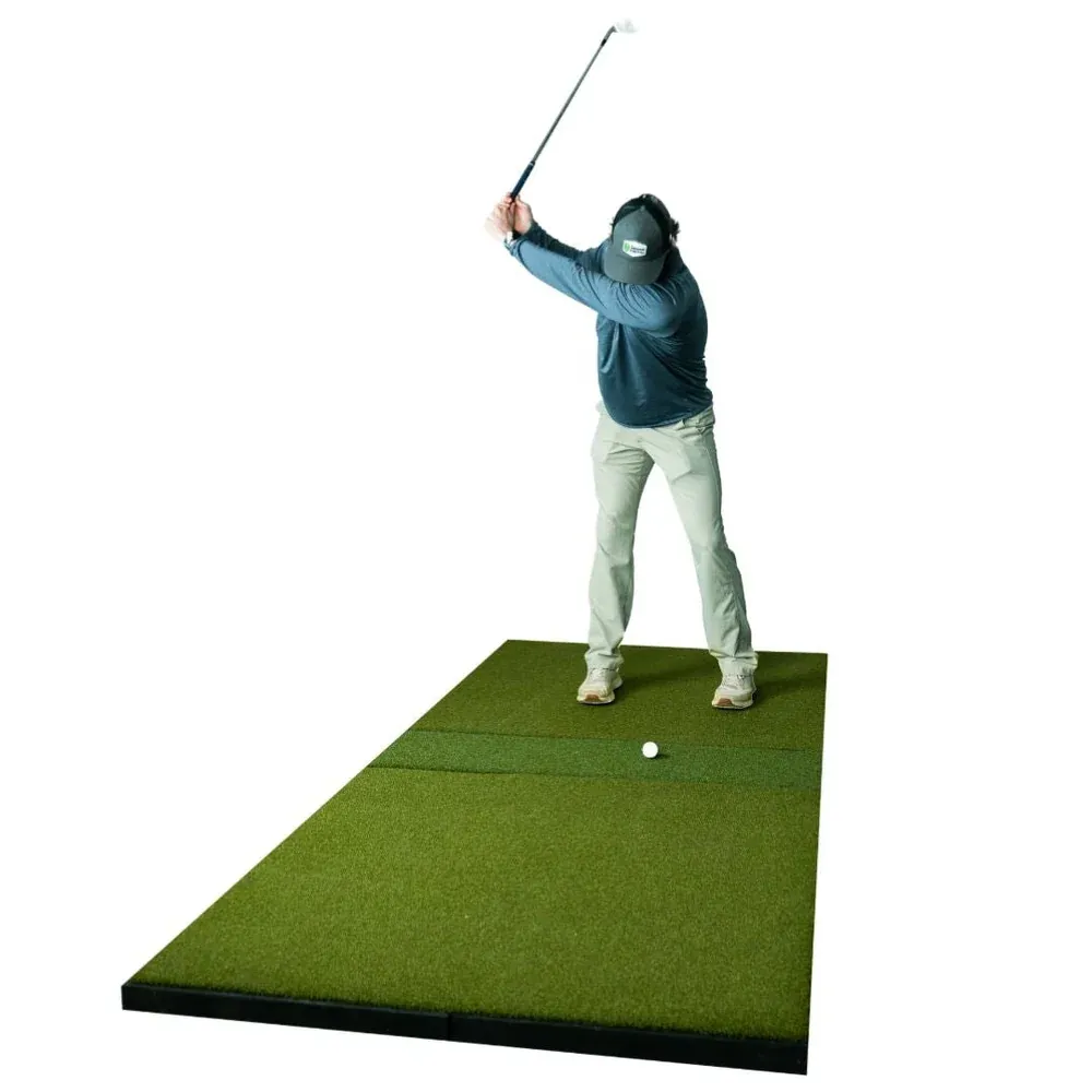 Golfer hitting off a SIGPRO Super Softy mat